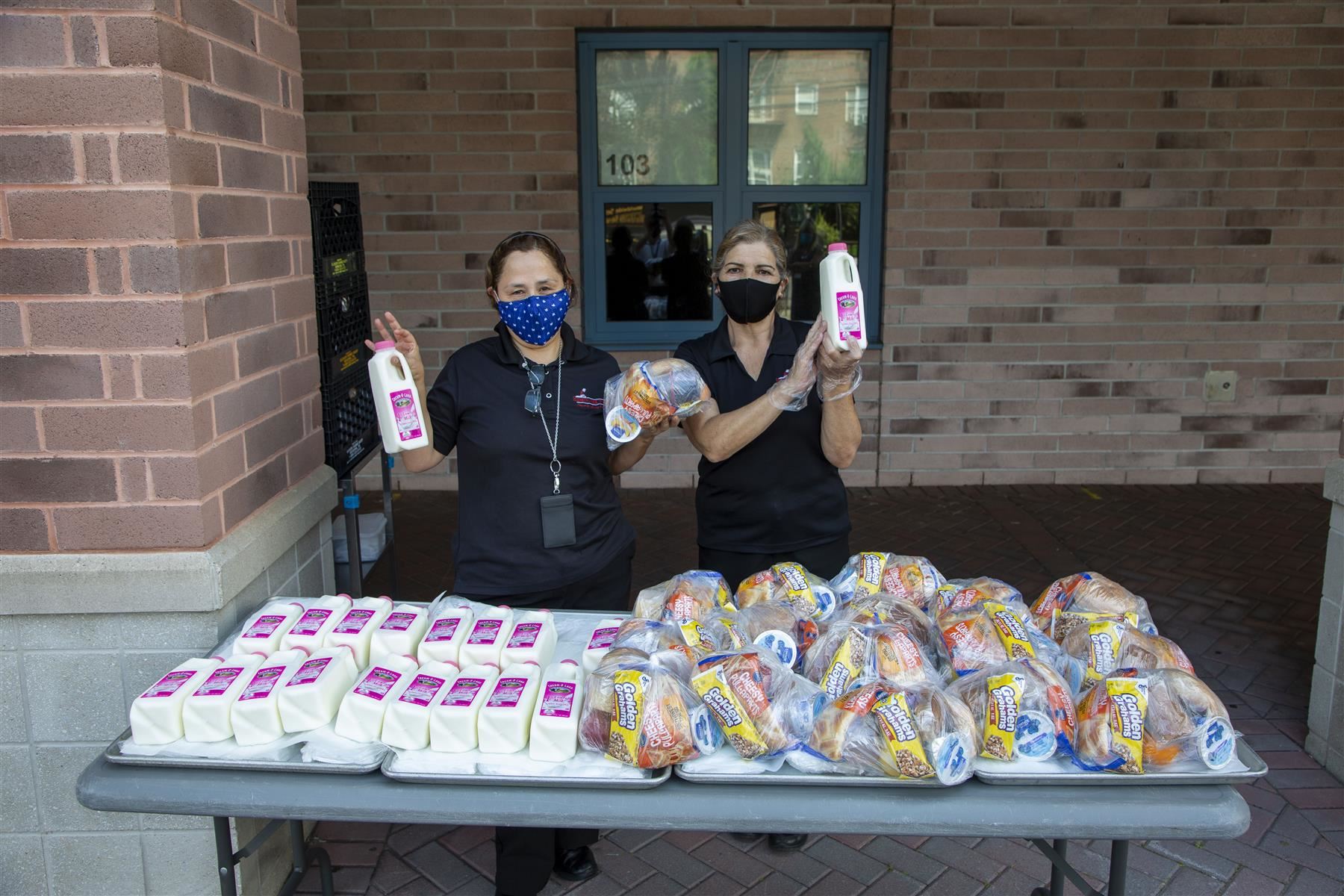 EPS Team Members serving Grab-n-Go Meals at School 29. EPS serves Breakfast and Lunch to the community at 8 different locati
